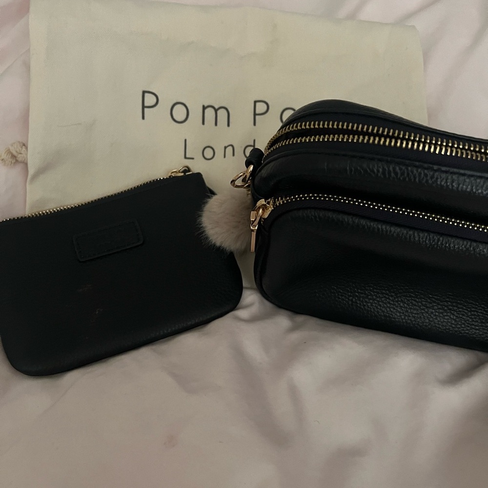 Like new Pom Pom navy leather crossbody bag with wallet Pom Pom and three straps
